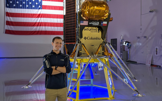 Matt Klosterman stands in front of the Odysseus spacecraft that recently landed on the moon. Photo by Intuitive Machines/Nick Rios.