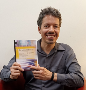 Dr. Shank with his new book. 