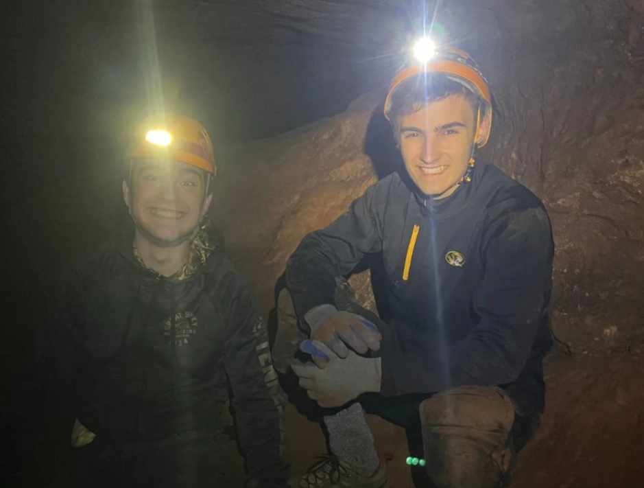 Two Missouri S&T student spelunkers smiling for the camera in a local cave.