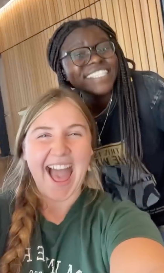 A screenshot of an Instagram reel of two Missouri S&T students smiling for a vlog.
