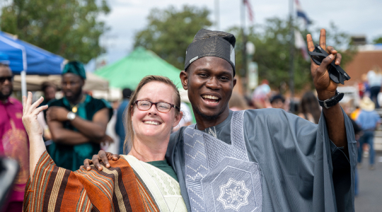 Two people smiling for the camera at the Missouri S&T Celebration Of Nations event.
