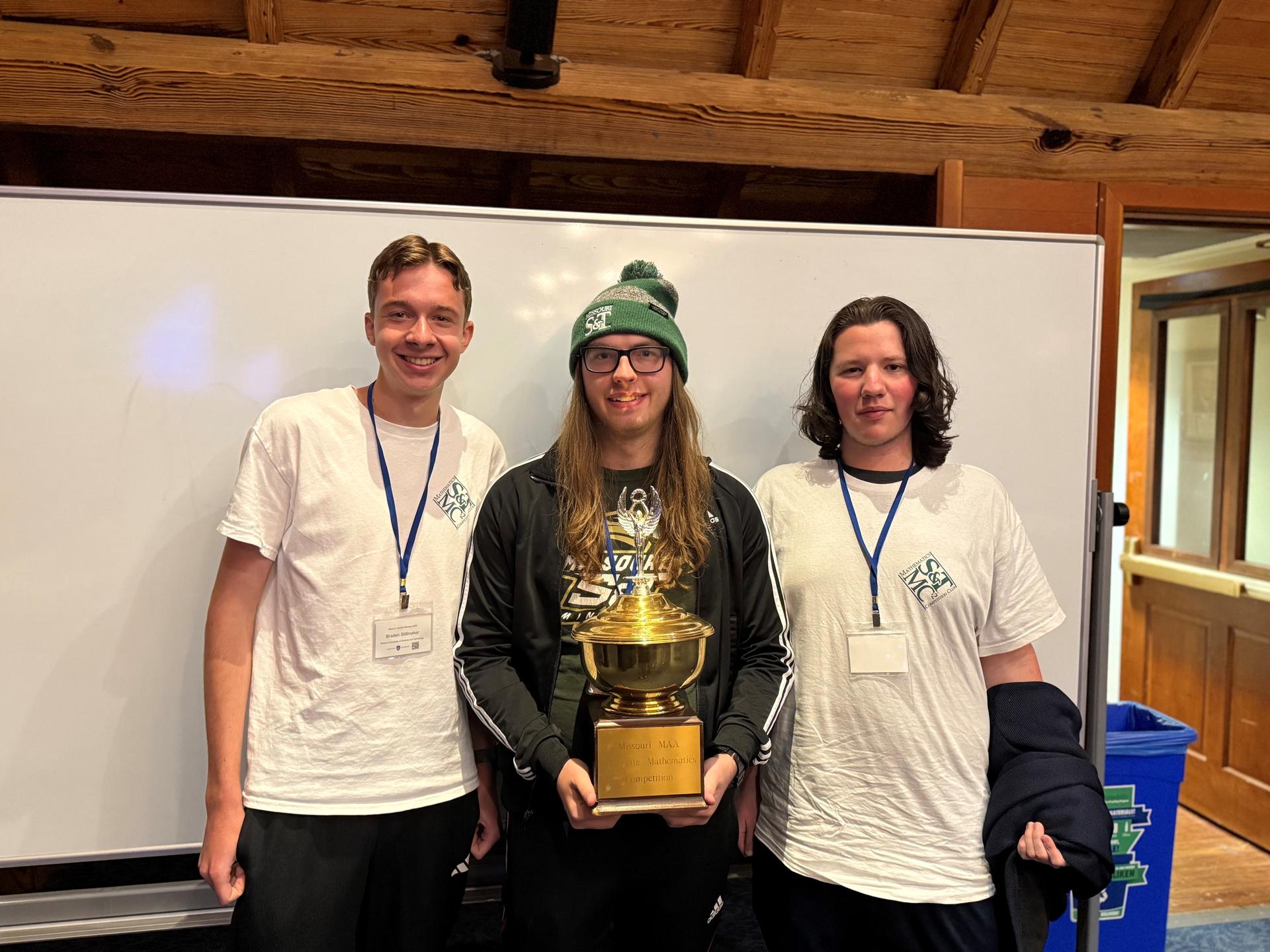 Math Competition Club with the trophy. 