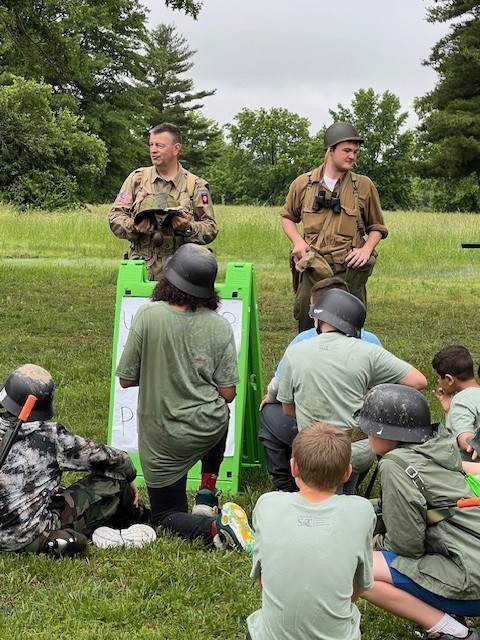 Campers listen to faculty instructions.