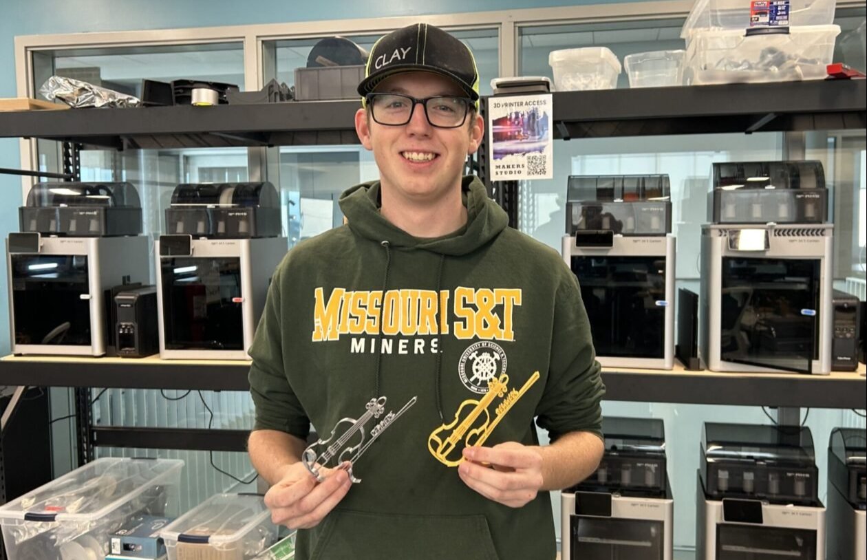 Clay Bernhard, a junior in aerospace engineering and Makers Studio shop supervisor, created a 3D printed miniature violin that will be handed out at Joshua Bell’s event as part of the Remmers Lecturer Series. Photo by Kaitlin Brothers.