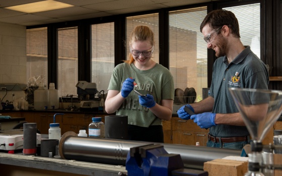 Image of a female and a male student collaborating in a materials lab