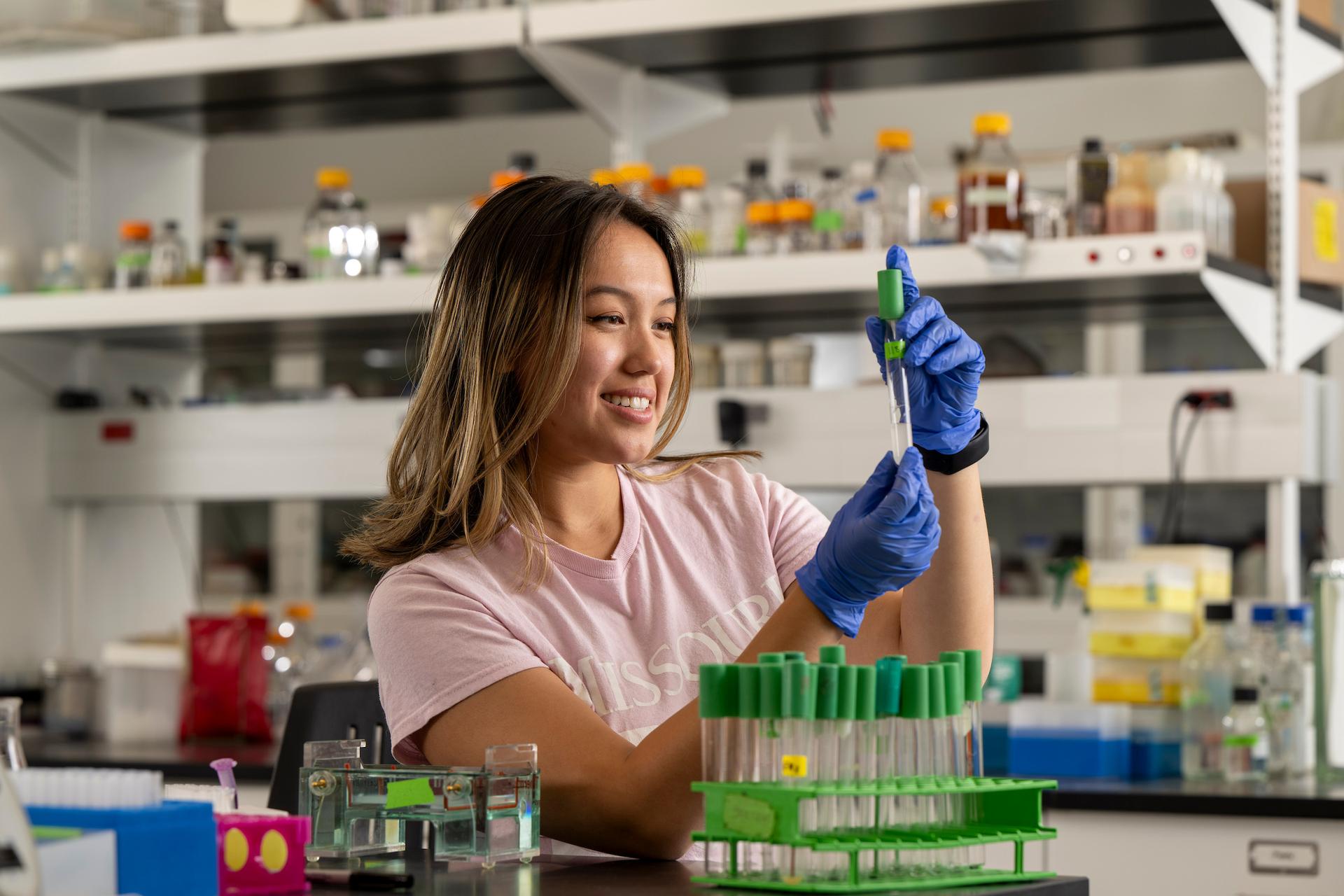 Amelia Markwell working in a Schrenk Hall laboratory. 