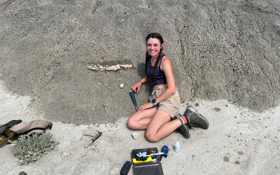 Photo of Emma Puetz on site of the discovery of a triceratops frill