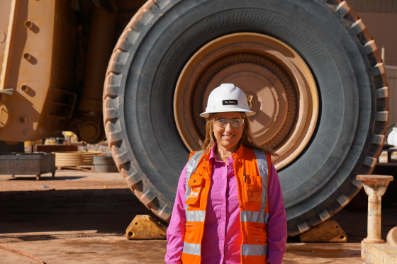 Photo of Fiorella Giana wearing a hard hat and orange vest