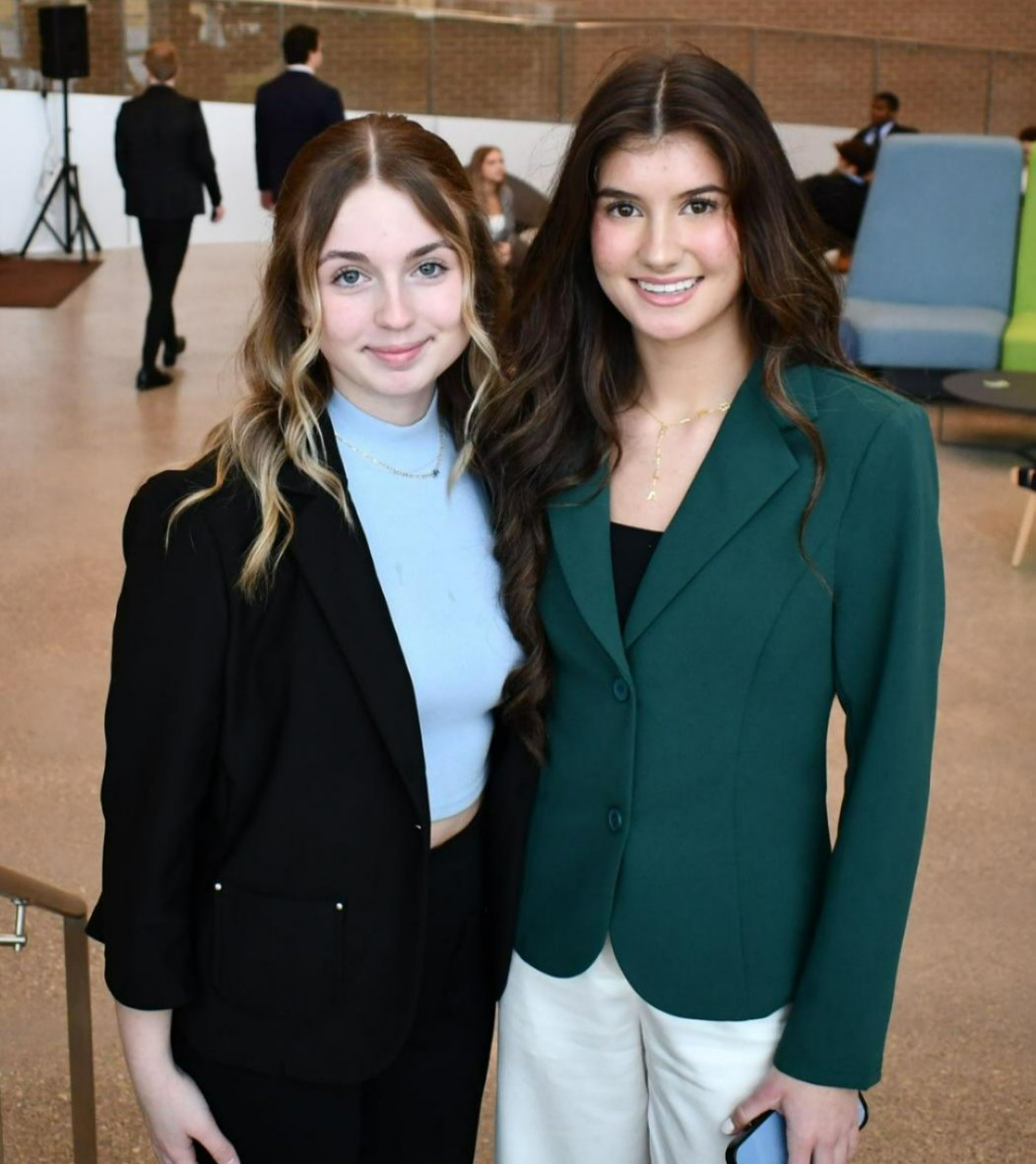 Two high school students pose for a photo during S&T's DECA event.